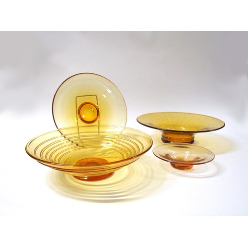 1321 - Four Amber glass bowls including Whitefriars trailed example.  Largest diameter 29.5cm