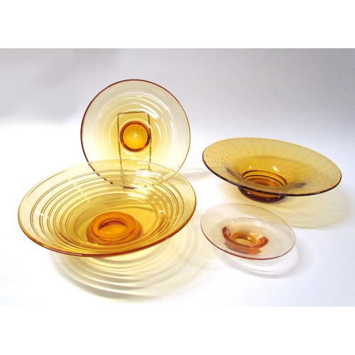 1321 - Four Amber glass bowls including Whitefriars trailed example.  Largest diameter 29.5cm