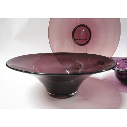 1322 - Three large amethyst glass bowls including Whitefriars waved example.  Largest diameter 26cm