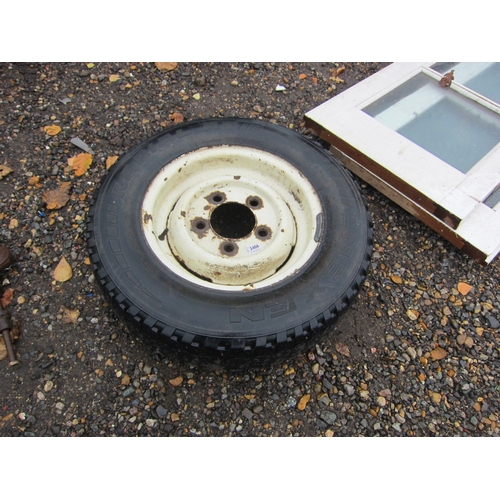 3406 - A Land Rover wheel with tyre