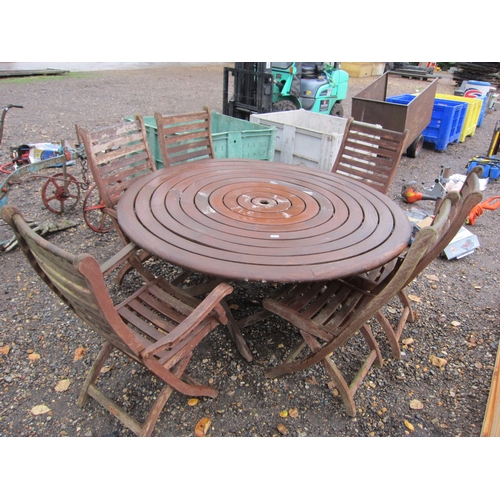 3434 - A wooden circular garden table and six chairs