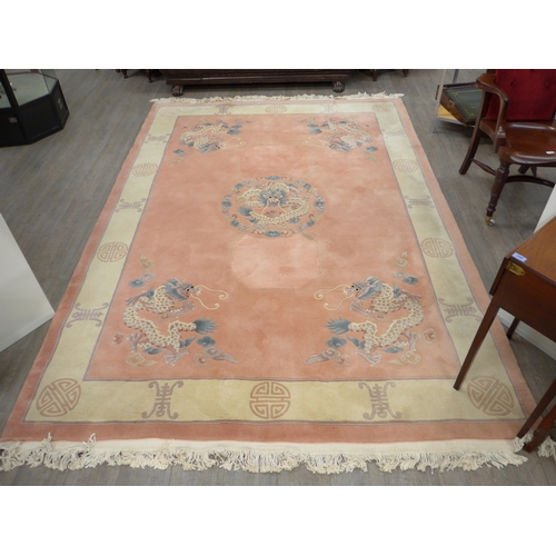 6467 - A modern Chinese rug with Chinese symbols to border, 305cm x 217cm