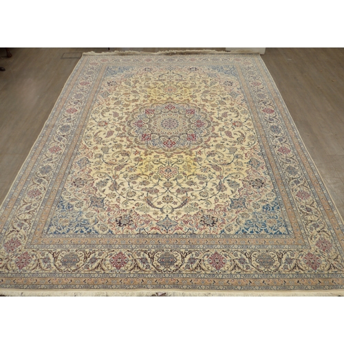 6462 - A Persian rug of large proportions, cream ground, multiple borders all over scroll foliate pattern, ... 