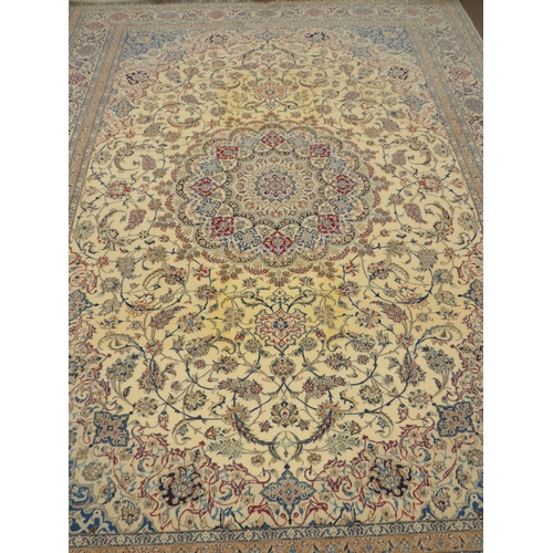 6462 - A Persian rug of large proportions, cream ground, multiple borders all over scroll foliate pattern, ... 