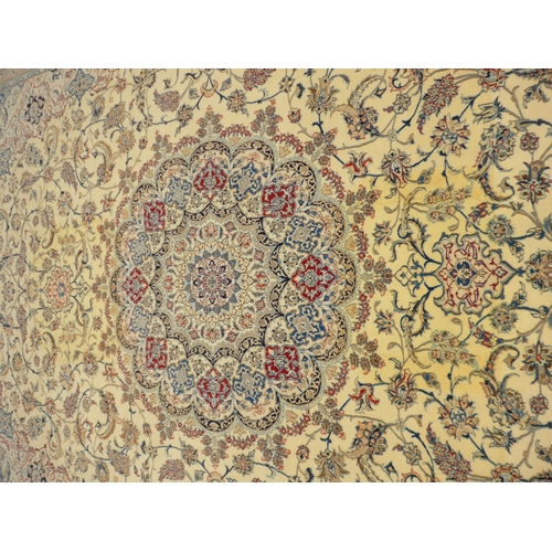 6462 - A Persian rug of large proportions, cream ground, multiple borders all over scroll foliate pattern, ... 