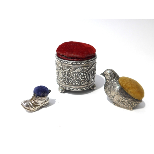 6421 - Three silver pin cushions including Chick, 3.7cm tall marks rubbed, boot 2.2cm tall and embossed pot... 