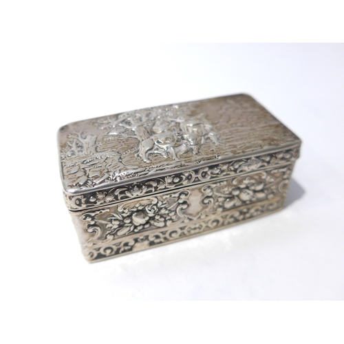 6397 - A 19th Century imported silver trinket box with embossed scene to top, London 1891 worn and small ho... 