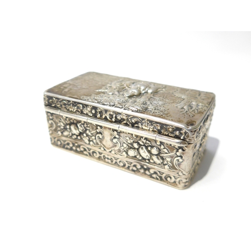 6397 - A 19th Century imported silver trinket box with embossed scene to top, London 1891 worn and small ho... 