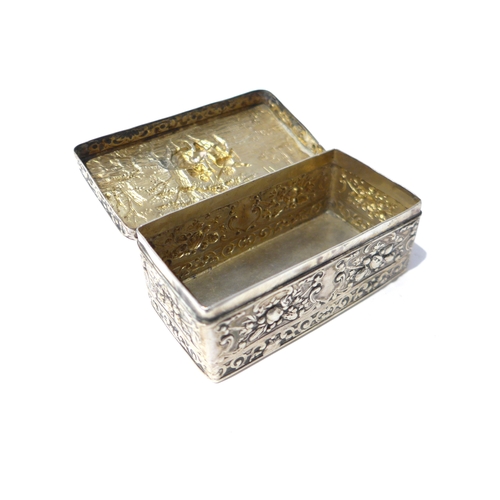 6397 - A 19th Century imported silver trinket box with embossed scene to top, London 1891 worn and small ho... 