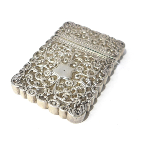 6392 - A white metal cardcase with all over floral leaf design, 10cm x 7cm