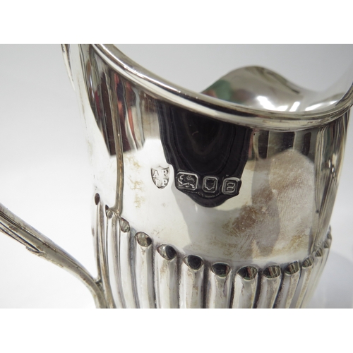 6433 - A Vander & Hedges silver milk jug and sugar bowl with melon fluted detail, London 1937, 10.5cm and 9... 