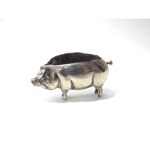 6395 - An Adie & Lovekin Ltd silver pincushion as a pig, Birmingham 1907, 7cm