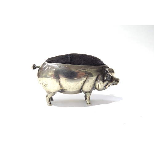 6395 - An Adie & Lovekin Ltd silver pincushion as a pig, Birmingham 1907, 7cm