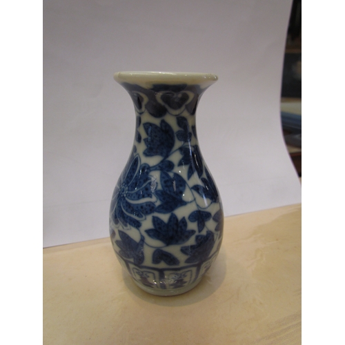 4323 - Five blue and white ornamental ceramics including vases, shell form dish and a figure of a gentleman... 