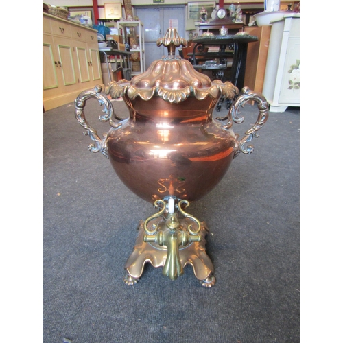 1001 - A Victorian copper two-handled pedestal samovar with frilled rims, fluted lid and brass spigot, on s... 