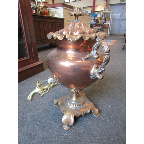 1001 - A Victorian copper two-handled pedestal samovar with frilled rims, fluted lid and brass spigot, on s... 