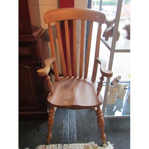 1004 - A pine country kitchen lathe back armchair on 'H' stretcher base, turned supports