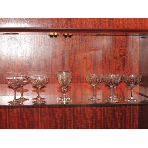 1005 - A pair of Royal Brierly cut wine glasses.  A set of four thumb cut champagne saucers with vine etche... 