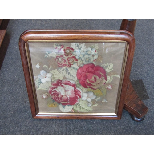 1013 - A Victorian rosewood pole screen with woolwork tapestry, picture of rose, worked in gros stitch and ... 