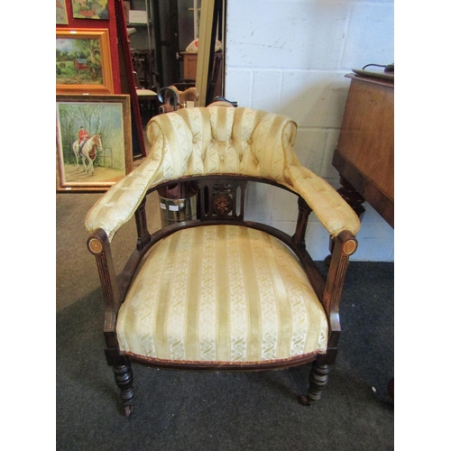 1015 - A pair of late Victorian/early Edwardian tub armchairs, upholstered with yellow stripe and button ba... 