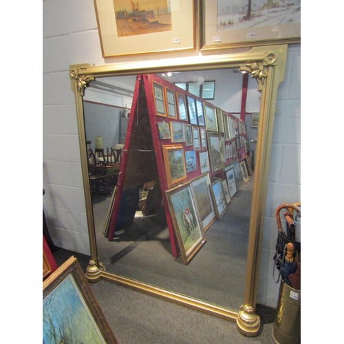 1034 - A large gilt sprayed Victorian overmantel mirror with floral embellishment, 164cm x 136cm