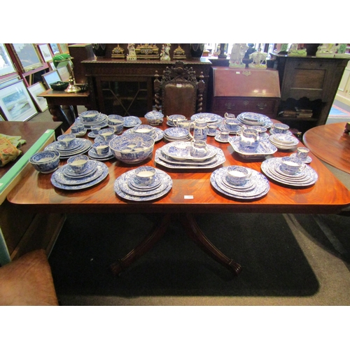 1099 - A Regency flame mahogany tilt-top breakfast table of rectangular form on brass castors