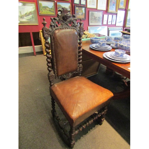 1100 - A pair of 19th Century Carolean style walnut high-back chairs, carved crest over barleytwist support... 