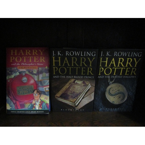 1107 - Three J.K. Rowling Harry Potter novels, including 'Harry Potter and the Philosopher's Stone', London... 