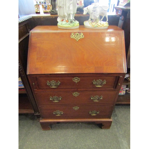 1110 - A mahogany bureau, drop-flap with fitted interior over three drawers on bracket feet, 105cm tall x 7... 