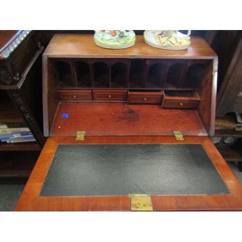 1110 - A mahogany bureau, drop-flap with fitted interior over three drawers on bracket feet, 105cm tall x 7... 