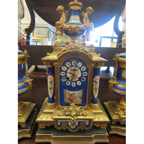 1112 - A late 19th Century French porcelain and ormolu three-piece clock garniture, the clock with black Ro... 