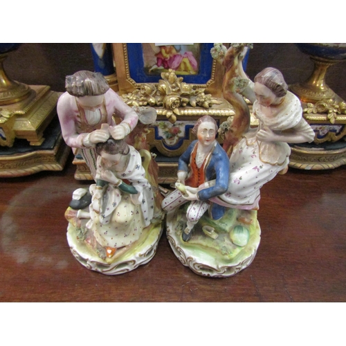 1113 - A pair of 18th Century English porcelain figure groups, a lady seated having her hair dressed by a g... 