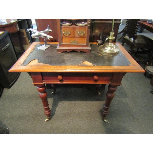 1119 - A Victorian lady's writing desk with leather insert top (a/f), single drawer on turned legs to ceram... 