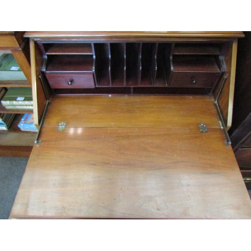 1126 - A 20th Century satin walnut bureau, drop-flap, three long drawers on bracket feet, 102cm tall x 86cm... 