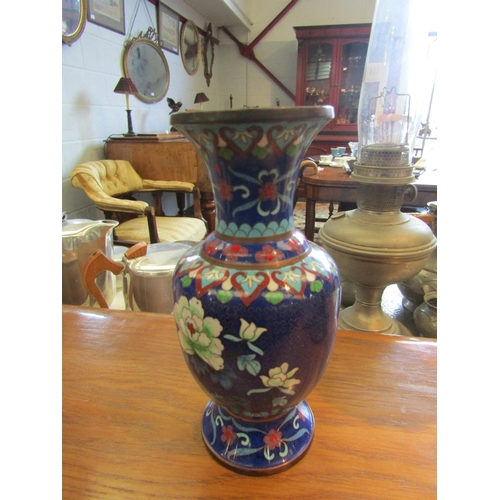 1155 - A pair of 20th Century Oriental cloisonne vases with floral decoration, one a/f, 21cm tall