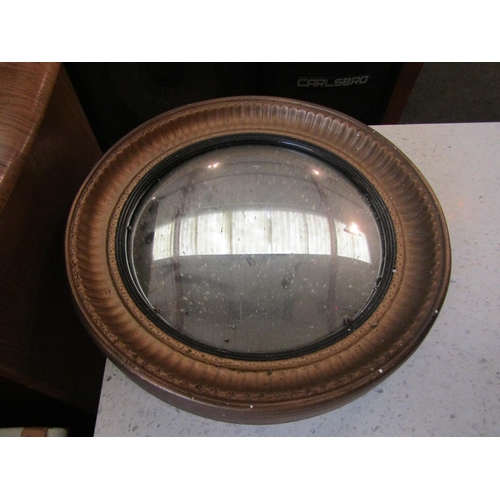 1160 - A gilt framed convex wall mirror, 33cm diameter