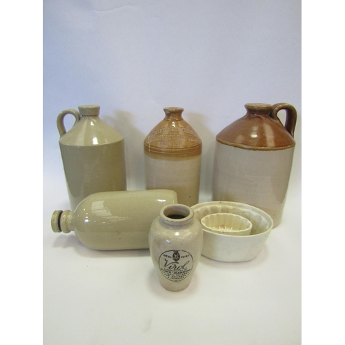 1330 - A group of stoneware flagons together with jelly moulds and a jug (7)