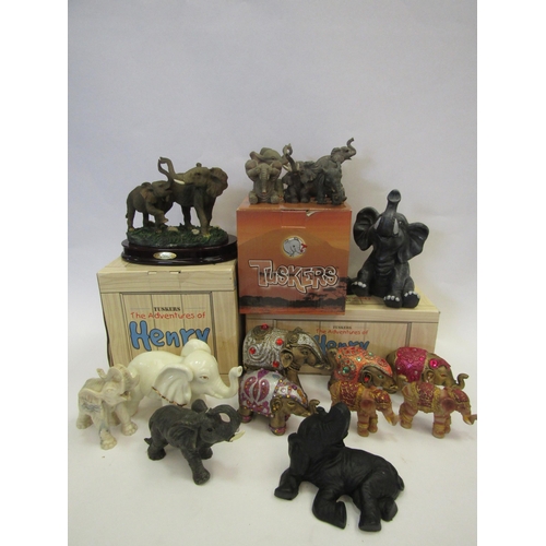 1341 - A collection of elephant figures including boxed Tuskers and Indian design elephants