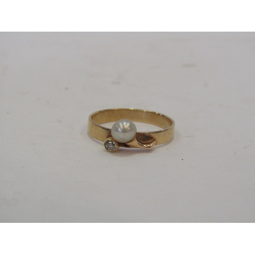 1355 - A 9ct gold pearl and diamond dress ring of contemporary style, 2g