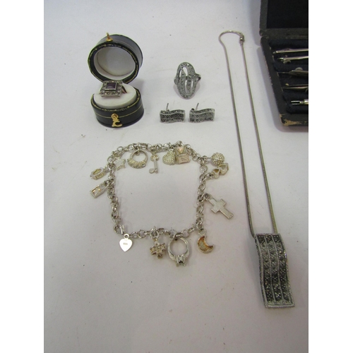 1363 - A group of bijouterie including a charm bracelet stamped 925, watch, marcasite necklace, ring, earri... 