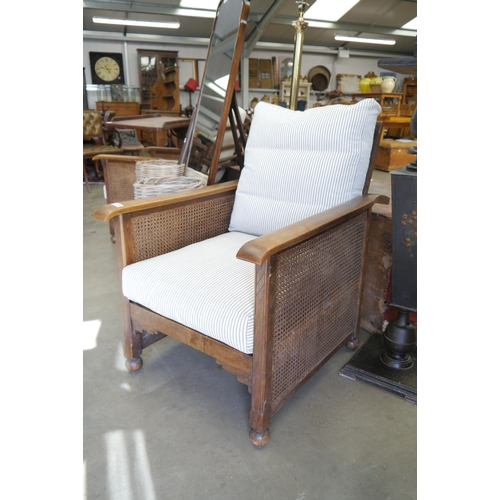 2001 - A pair of 1920's bergere armchairs with double cane sides, re-upholstered cushions