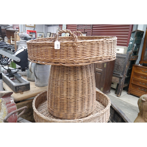 2015 - A large wicker display basket on stand