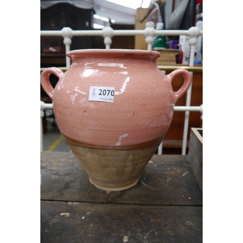 2070 - A glazed terracotta handled pot