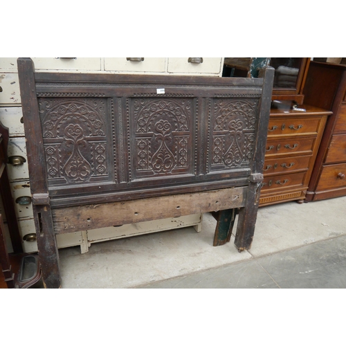 2086 - A 17th Century carved oak headboard