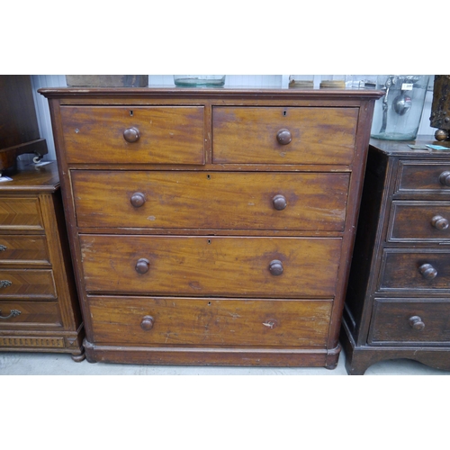 2094 - A Victorian mahogany chest of two short over three long drawers, bun handles (one missing)