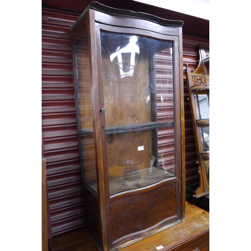 2108 - A 1930's flame mahogany display cabinet with curved glass front