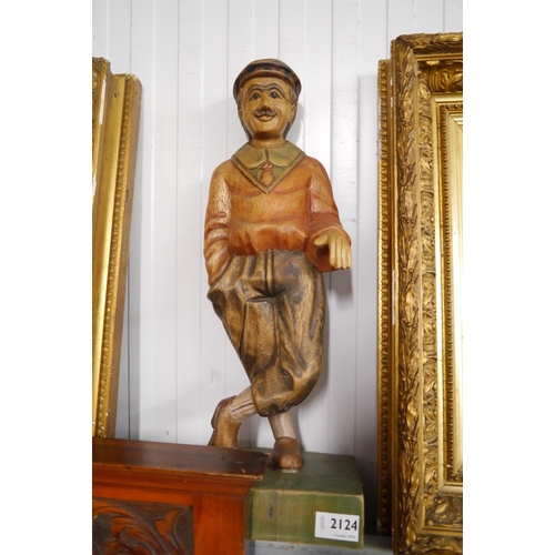 2124 - A carved hardwood Vintage golfer