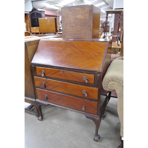 2482 - A 1930's mahogany bureau, on ball and claw feet