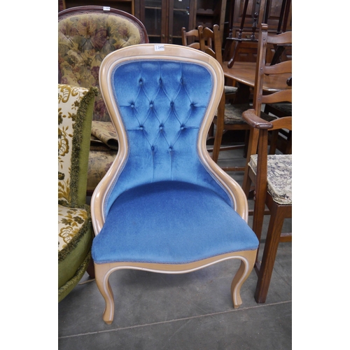 2490 - A Victorian style nursing chair with blue upholstery