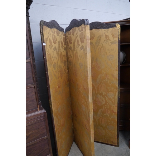 2497 - A four fold Oriental carved mahogany room divider, with brass detail